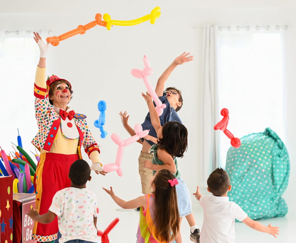 Bee Bee the Clown with animal balloons and kids